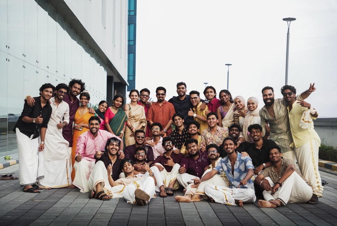 The SOF cohort and team together outside the Kochi campus, dressed in traditional Kerala kasavu